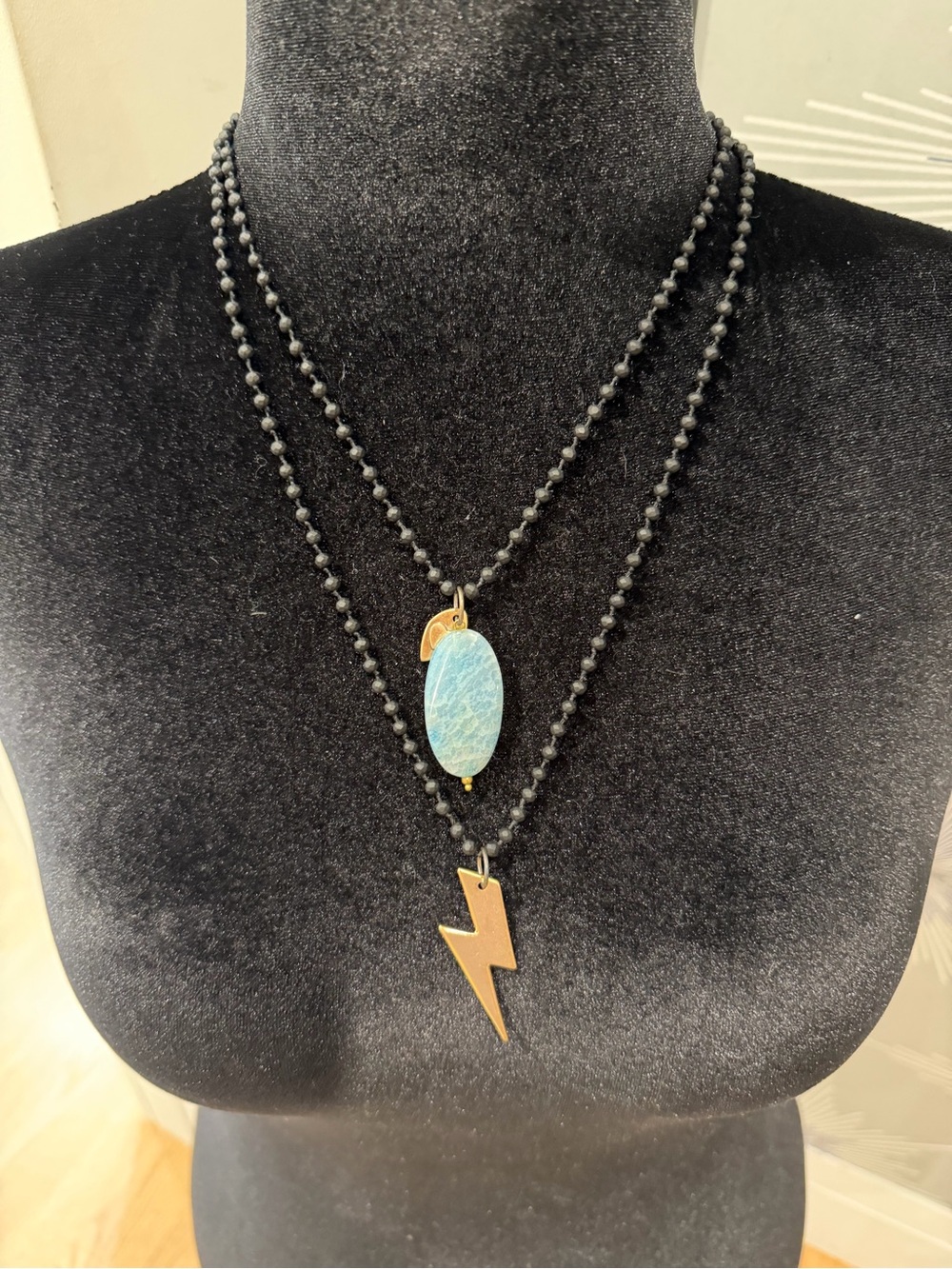 Katia Design Black Beaded Necklace with Blue Stone and Gold Lighting pendant